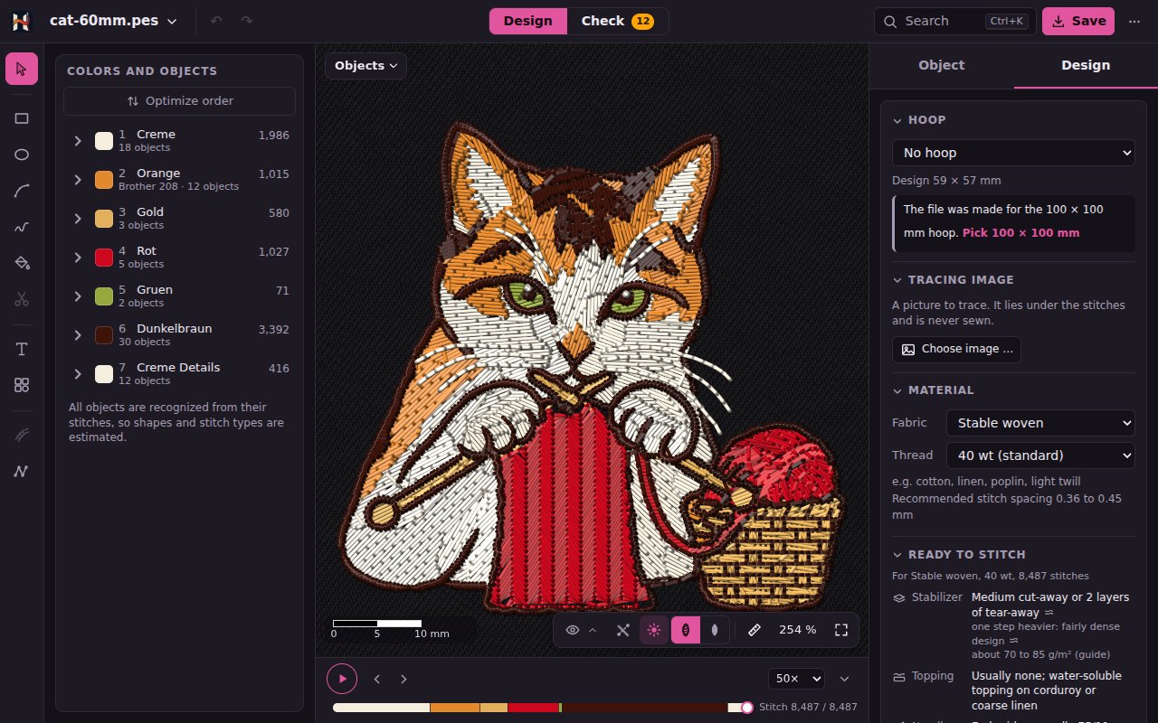 The example cat in Design, fully sewn in the realistic view: the colors with their objects on the left, the player below, the Design card on the right